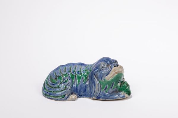 A PORCELAIN FIGURE