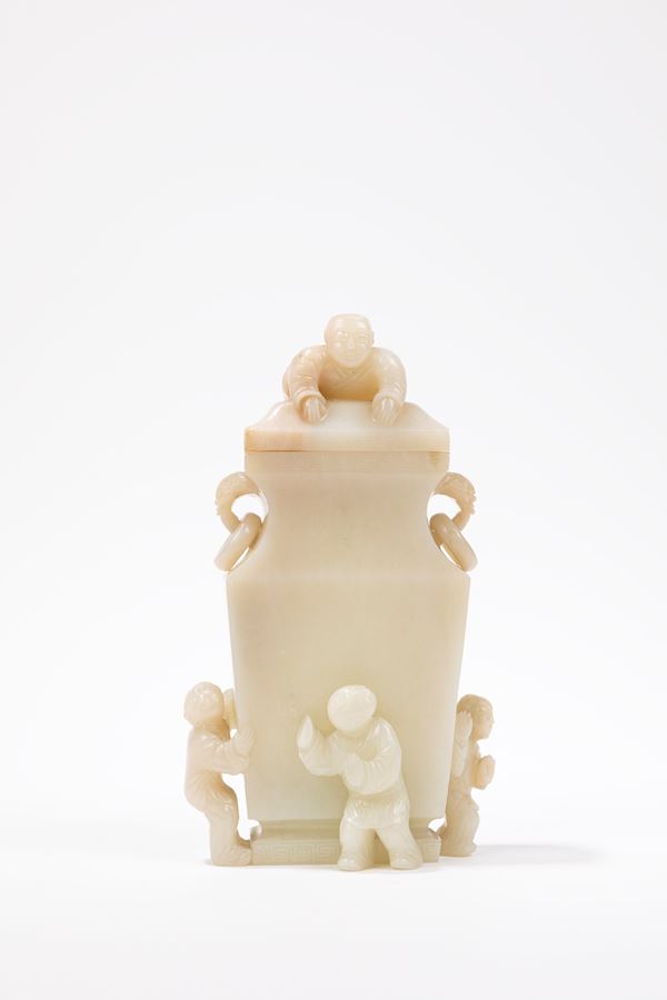 A WHITE JADE CARVED BOYS VASE AND COVER