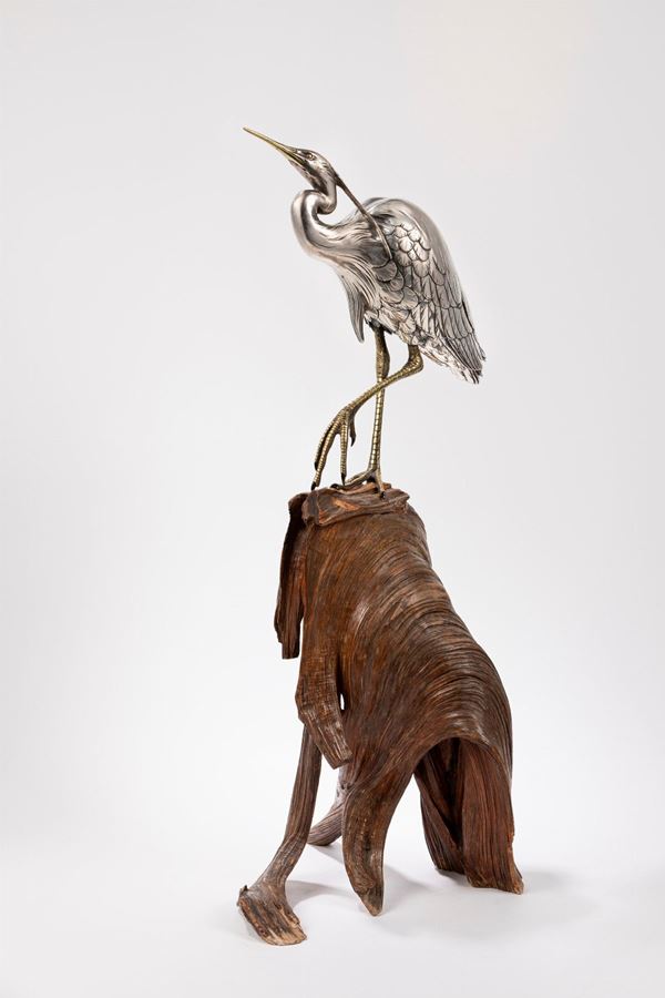 A SILVERED BRONZE OKIMONO