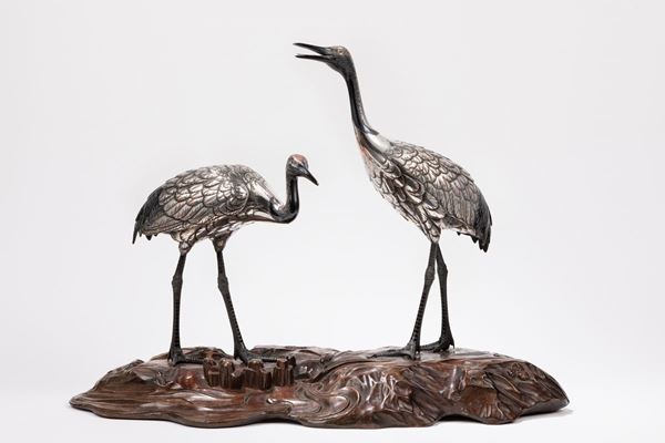 A SILVERED BRONZE OKIMONO