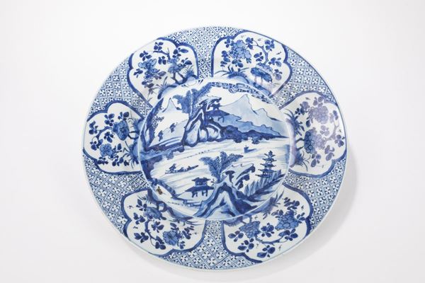A LARGE BLUE AND WHITE PLATE