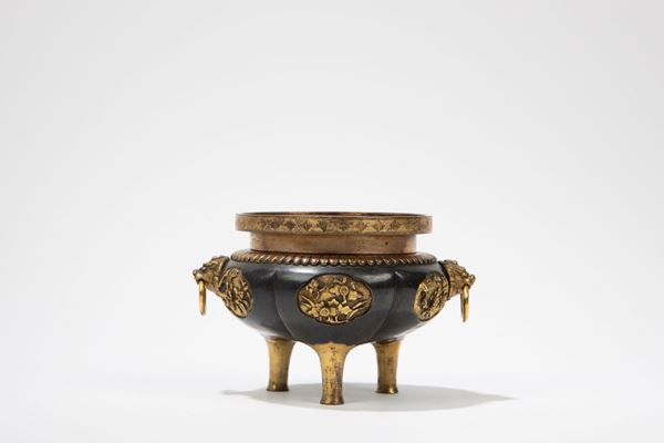 A BRONZE TRIPOD CENSER