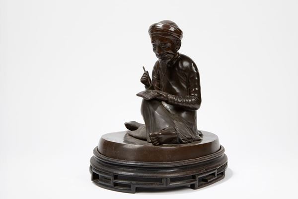 A BRONZE FIGURE