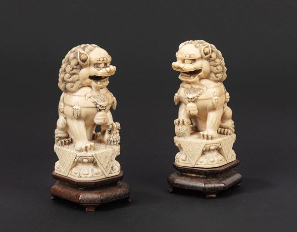 ☼A PAIR OF IVORY BUDDHIST LIONS