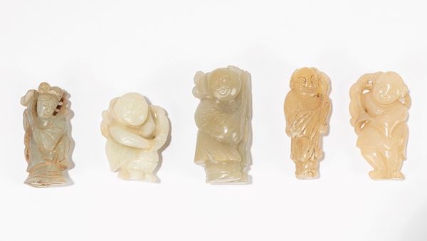 A GROUP OF FIVE CARVED JADE FIGURES