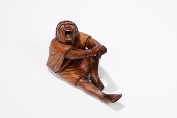A WOODEN OKIMONO