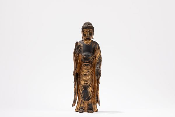A GILT-WOOD FIGURE