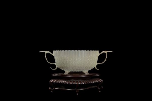 A SMALL CARVED JADE MUGHAL STYLE TWIN HANDLE CHRYSANTHEMUM SHAPE CUP