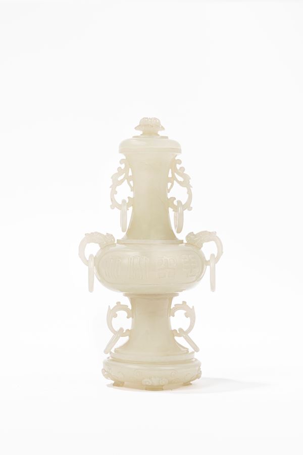 A FINELY CARVED WHITE JADE VASE AND COVER