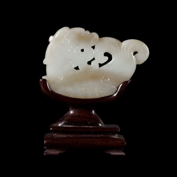 A CELADON CARVED JADE 