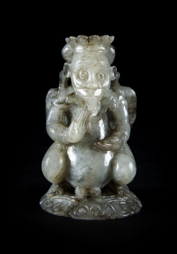  A RARE MOTTLED JADE FIGURE OF STANDING GARUDA