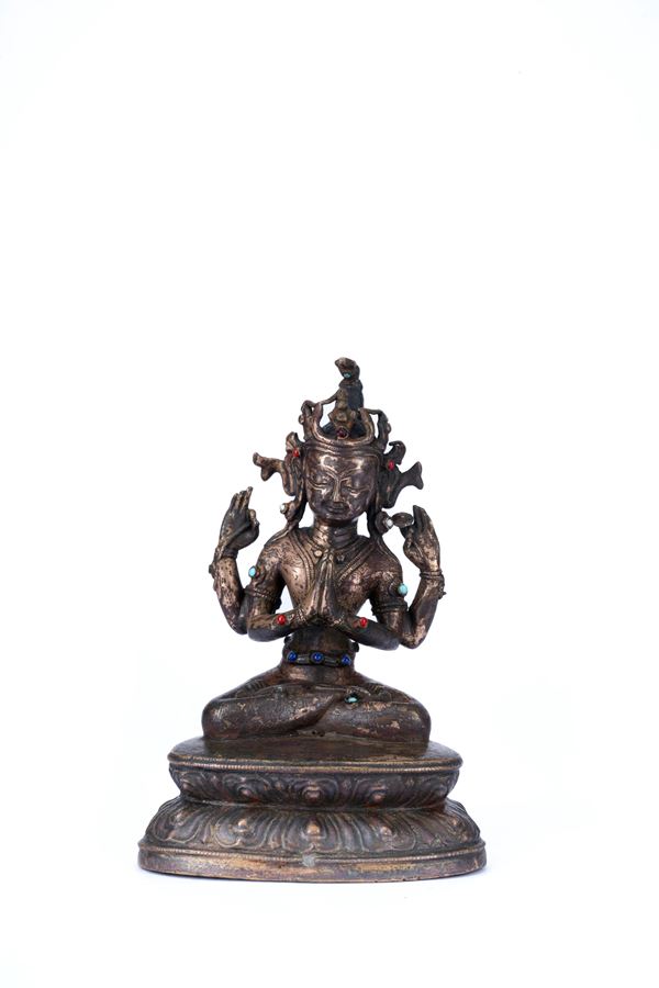 A BRONZE FIGURE OF AVALOKITESVARA