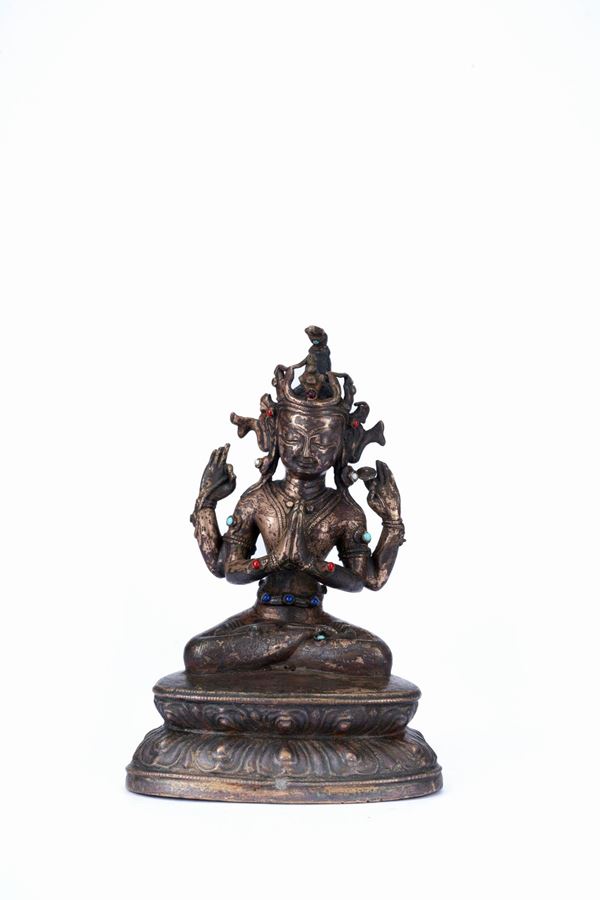 A BRONZE FIGURE OF AVALOKITESVARA