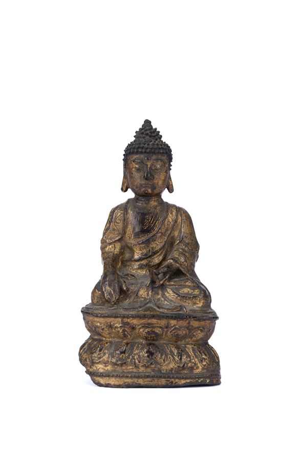 A GILT-BRONZE FIGURE