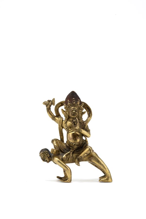 A SMALL GILT BRONZE FIGURE OF MAHAKALA