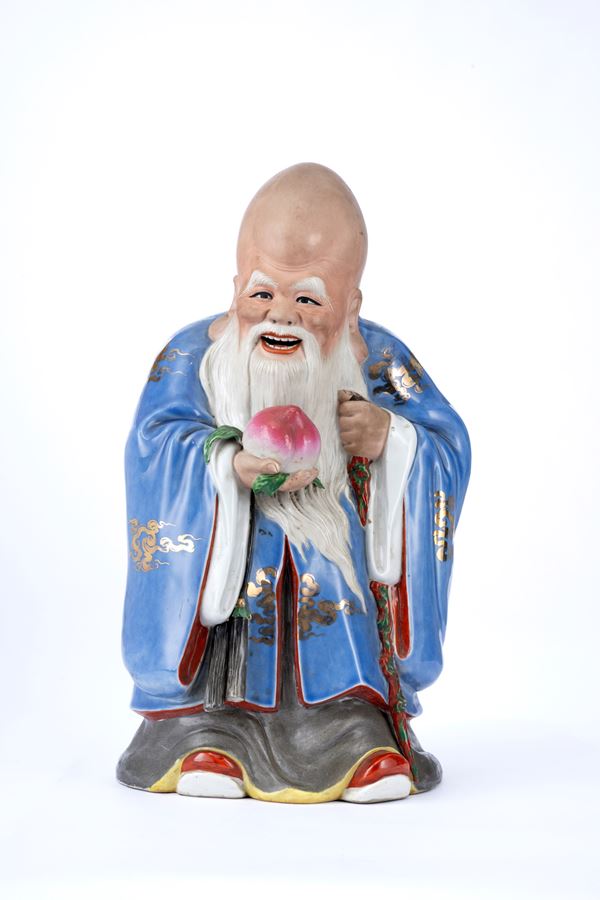 A PORCELAIN FIGURE