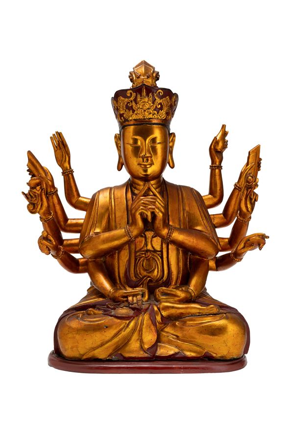 A LARGE WOODEN FIGURE OF QUAN AM