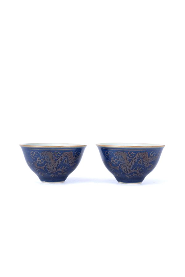 A PAIR OF GILT BLUE GROUND CUPS