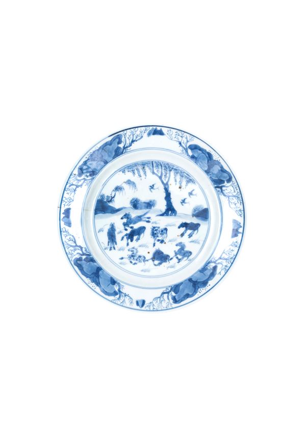 A BLUE AND WHITE 'EIGHT HORSES OF WANG MU' DISH