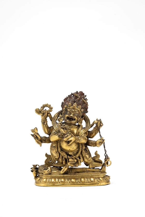 A RARE SMALL GILT BRONZE FIGURE OF MAHAKALA