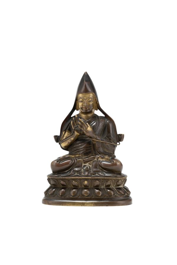 A GILT-BRONZE FIGURE OF TSONGKHAPA