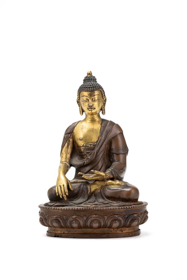 A GILT-COPPER ALLOY FIGURE OF SHAKYAMUNI