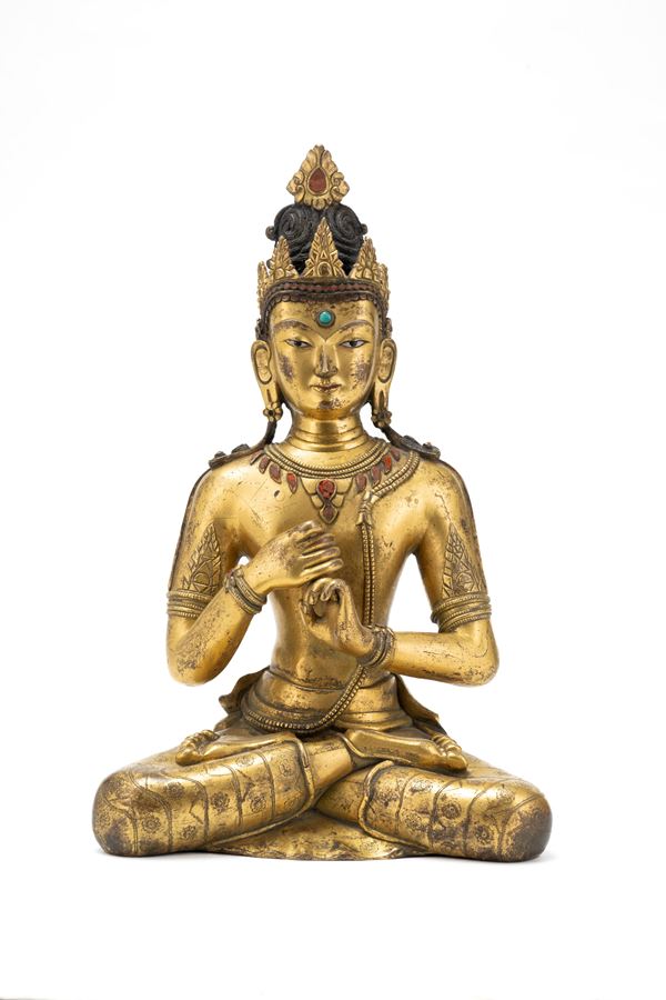 A LARGE GILT-BRONZE FIGURE OF VAIROCANA