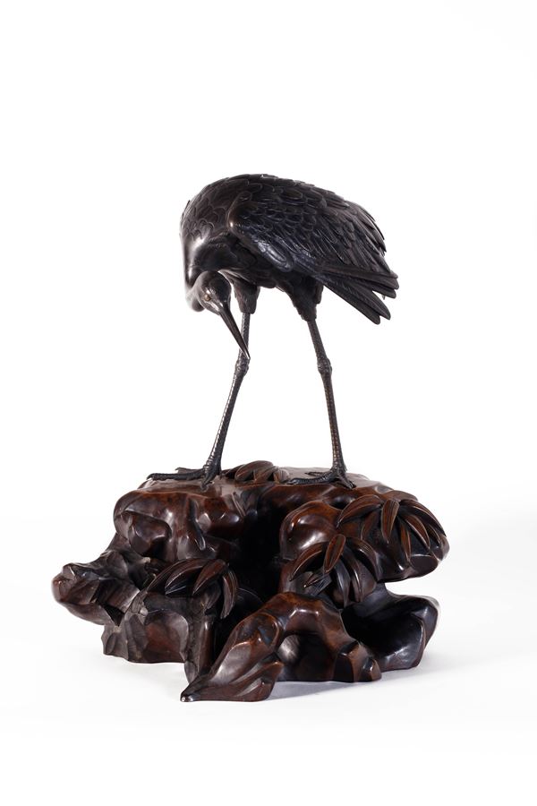 A PATINATED BRONZE OKIMONO