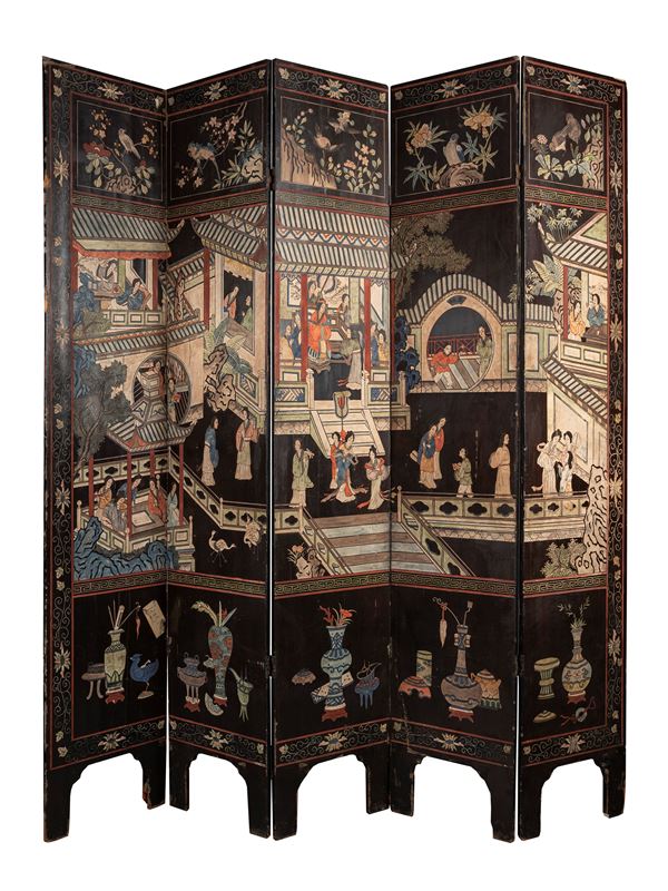 AN INSCRIBED AND POLYCHROME LACQUERED WOOD FOLDING SCREEN