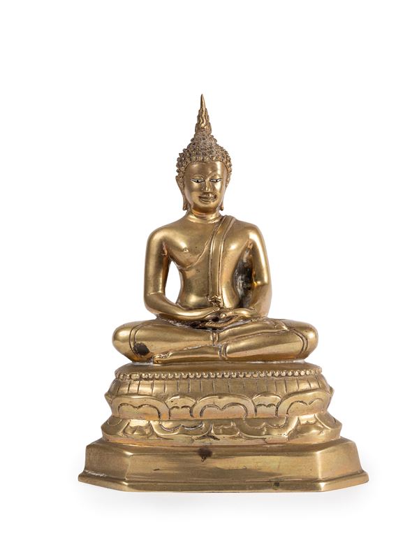 A BRASS FIGURE OF BUDDHA SAKYAMUNI