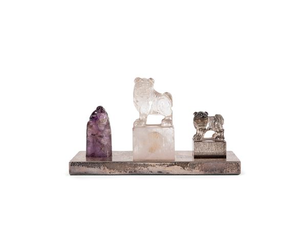 THREE SEALS ON A SILVER STAND