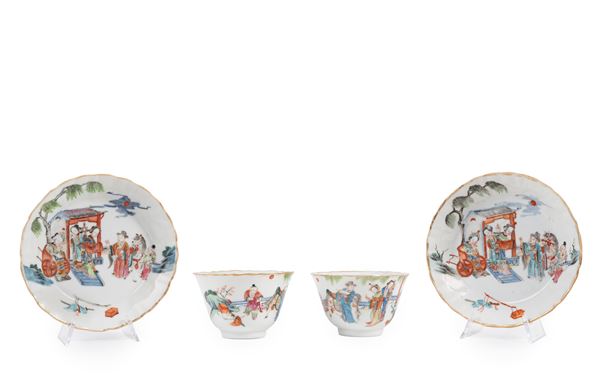 A PAIR OF FAMILLE ROSE CUPS AND SAUCERS