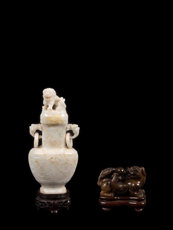 A STONE VASE AND A STONE CARVING