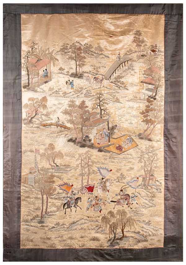AN EMBROIDERED SILK