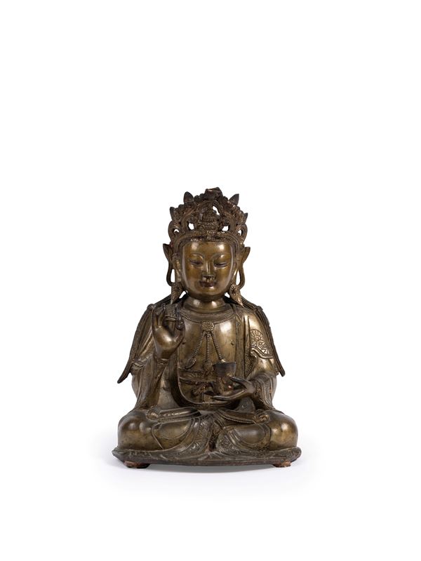 A BRONZE FIGURE OF AVALOKITESVARA