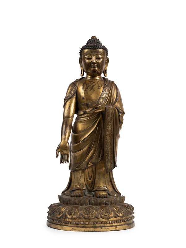 A RARE AND LARGE GILT-BRONZE FIGURE OF BUDDHA