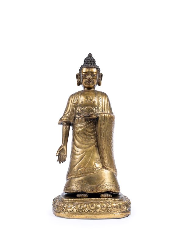 A GILT-BRONZE FIGURE OF BUDDHA