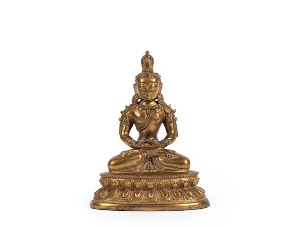 A GILT-BRONZE FIGURE OF AMITAYUS