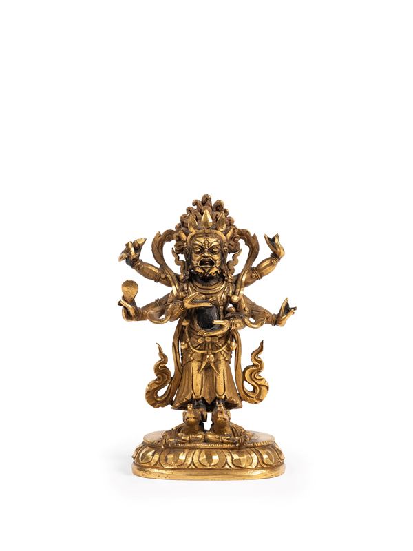 A GILT-BRONZE FIGURE OF SHADBHUJA MAHAKALA