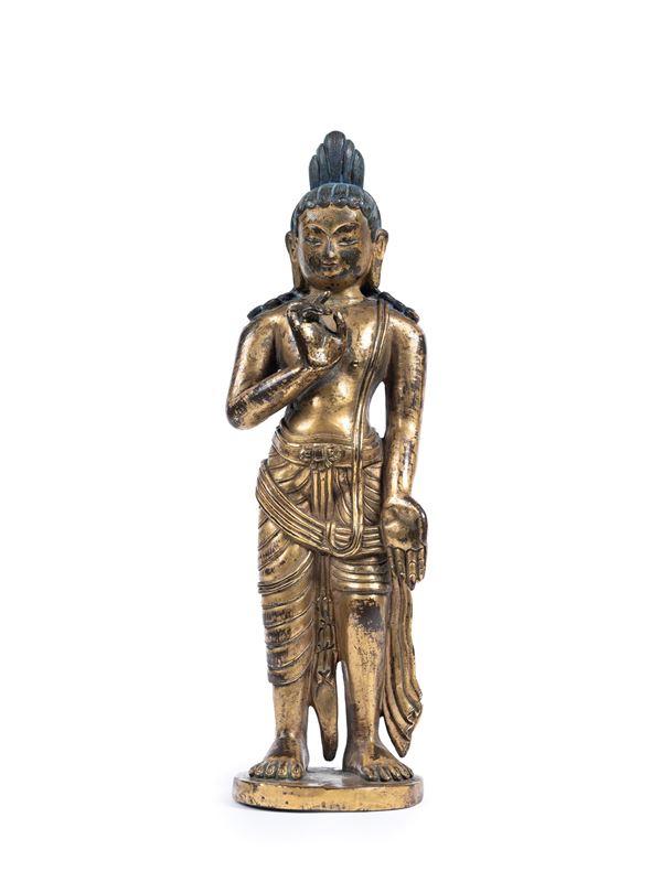 A RARE GILT-BRONZE FIGURE OF AVALOKITESVARA
