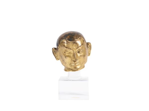 A GILT-BRONZE HEAD