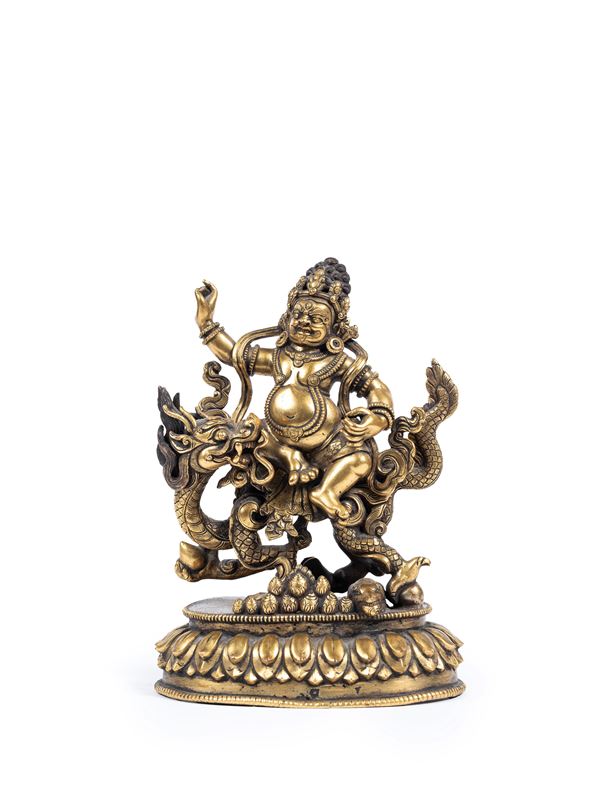A GILT-BRONZE FIGURE OF WHITE JHAMBALA