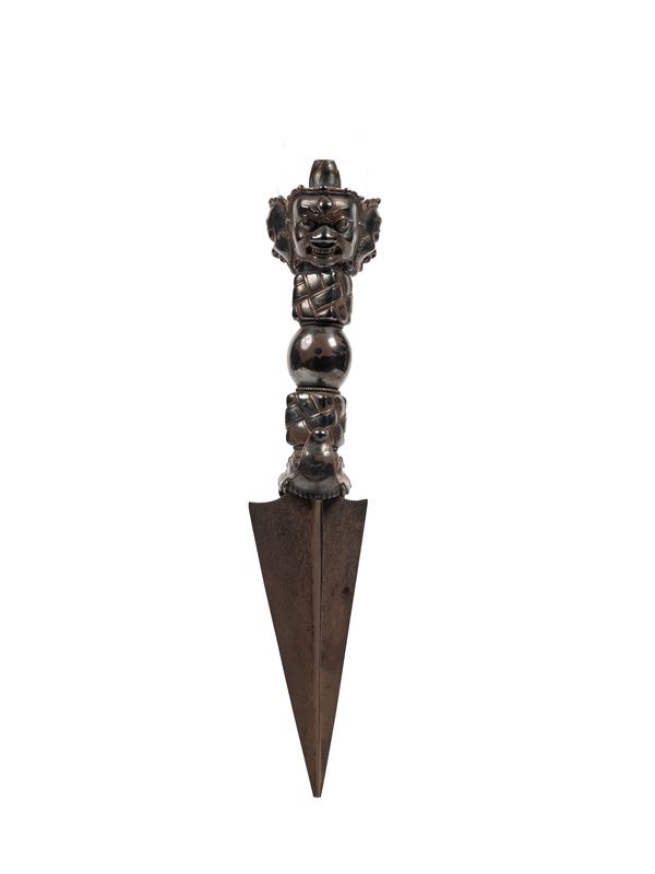 A BRONZE SILVER PLATED PHURBA