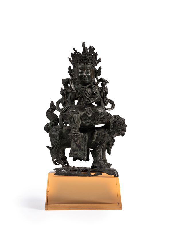 A BRONZE FIGURE OF AVALOKITESVARA