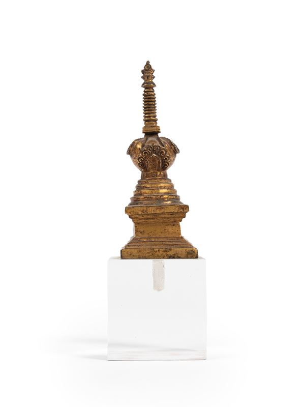 A SMALL BRONZE STUPA