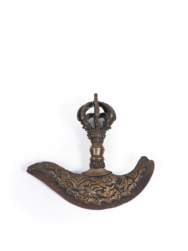 A BRONZE KARTIKA