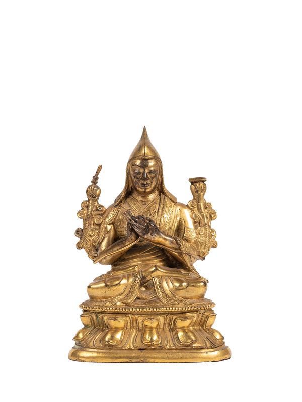 A GILT-BRONZE FIGURE OF TSONGKHAPA