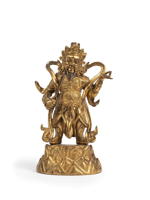 A RARE GILT-BRONZE FIGURE OF THE LOKAPALA OF THE SOUTH VIRUDHAKA