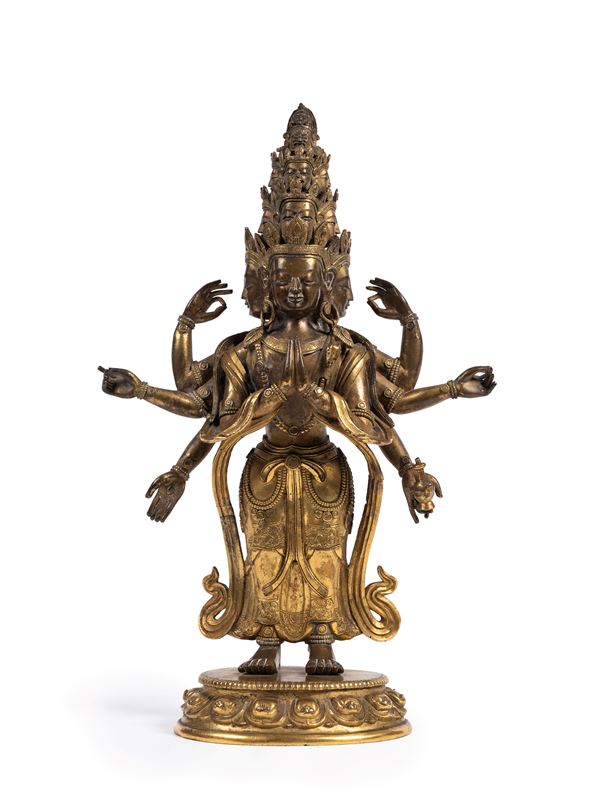 A RARE GILT-BRONZE FIGURE OF AVALOKITESVARA EKADASAMUDRA