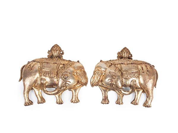TWO GIL-COPPER REPOUSSÉ ELEPHANTS